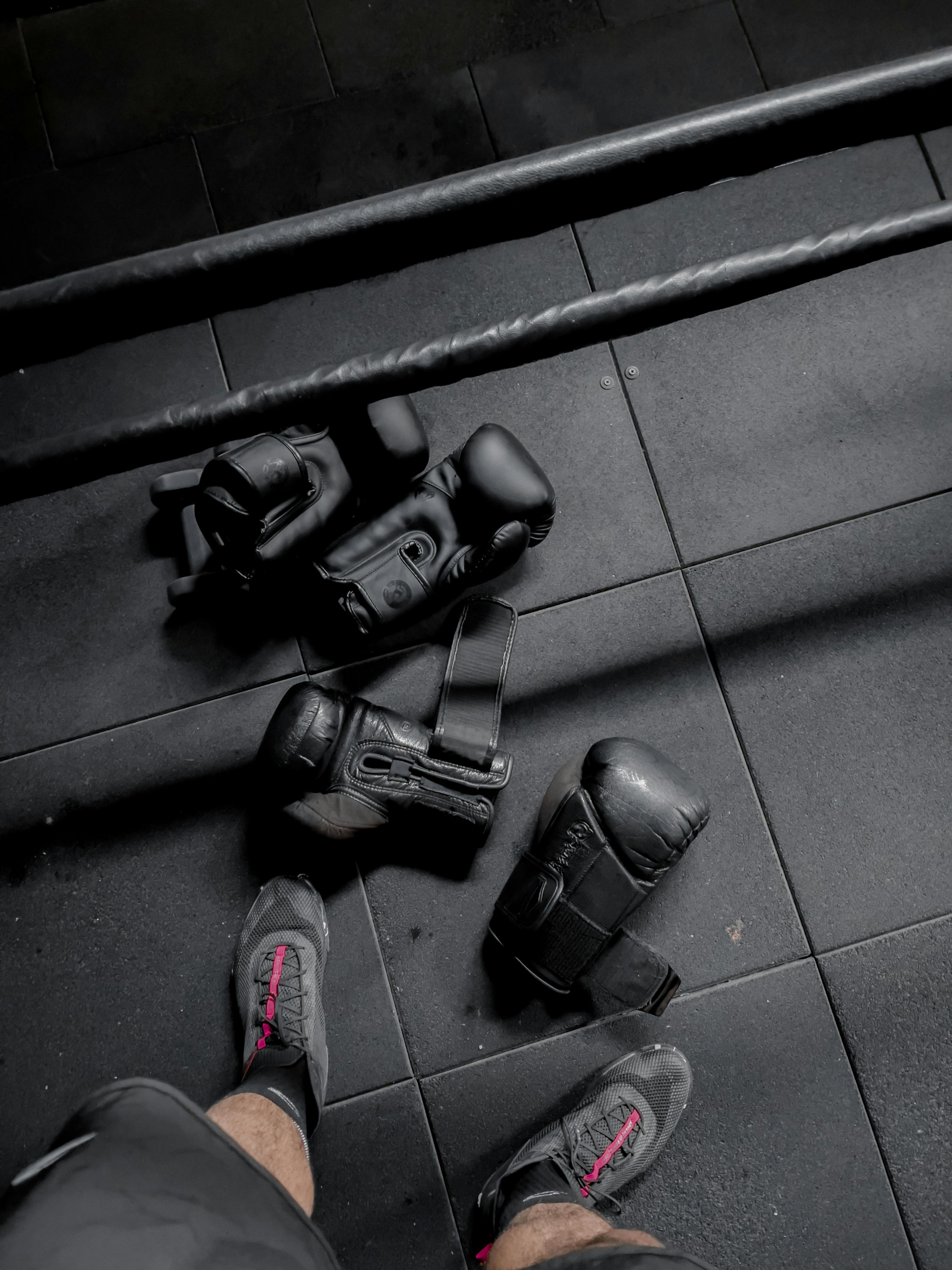 Boxing gloves on gym floor